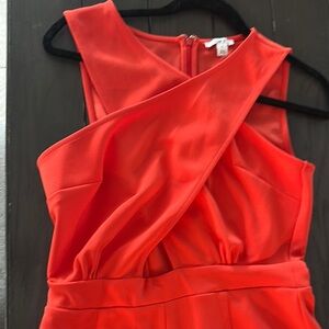 Short midriff romper. Reddish Orange